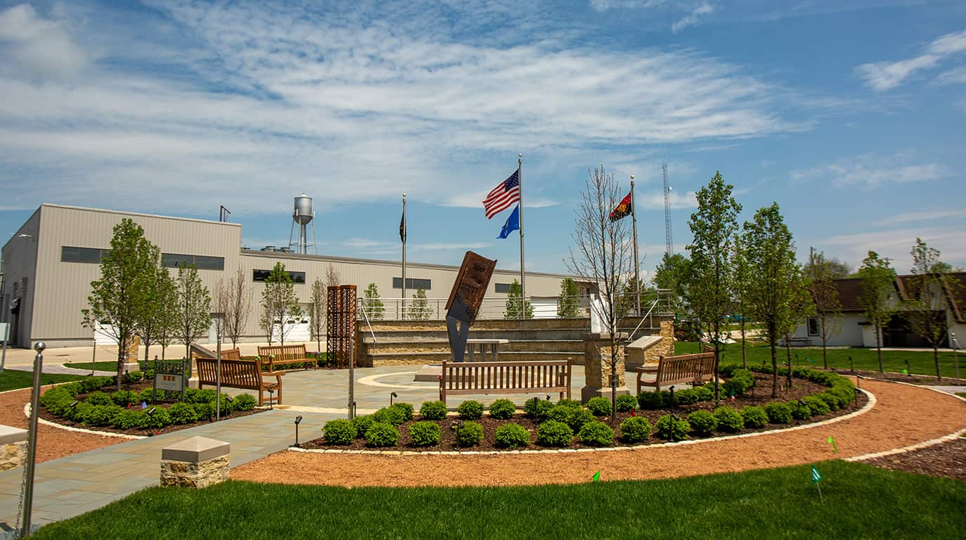 A photo of the Wisconsin 9/11 Memorial with blue sky in the background.