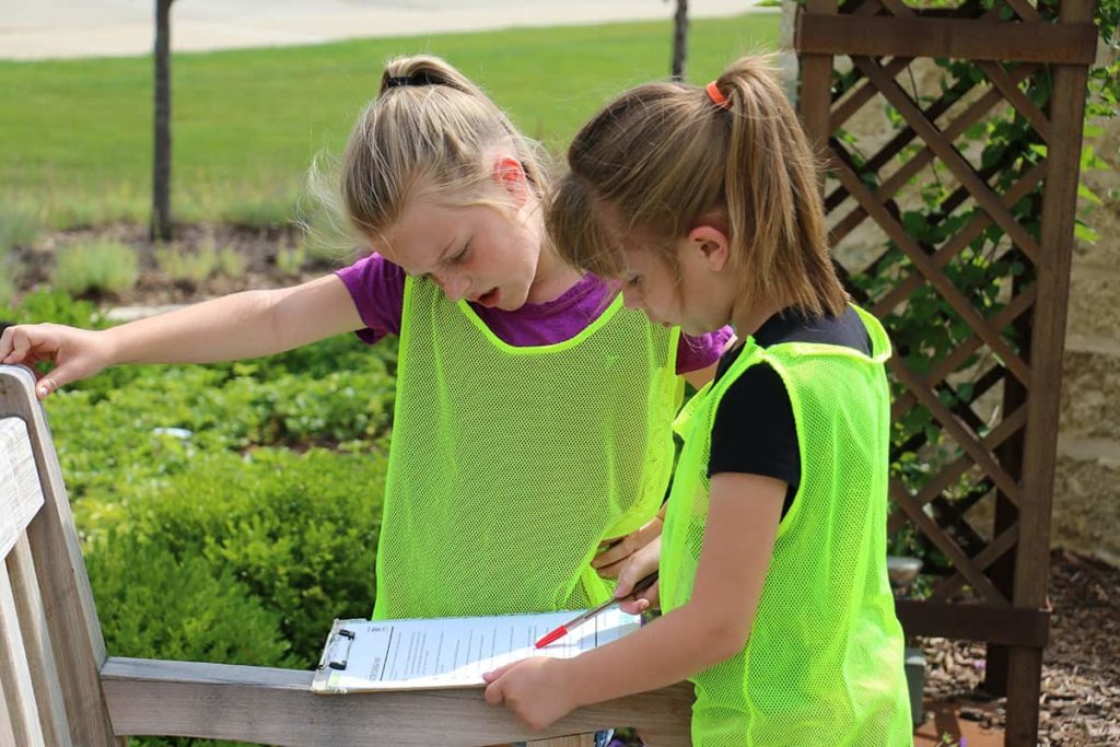 Two first graders looking at the 9/11 memorial