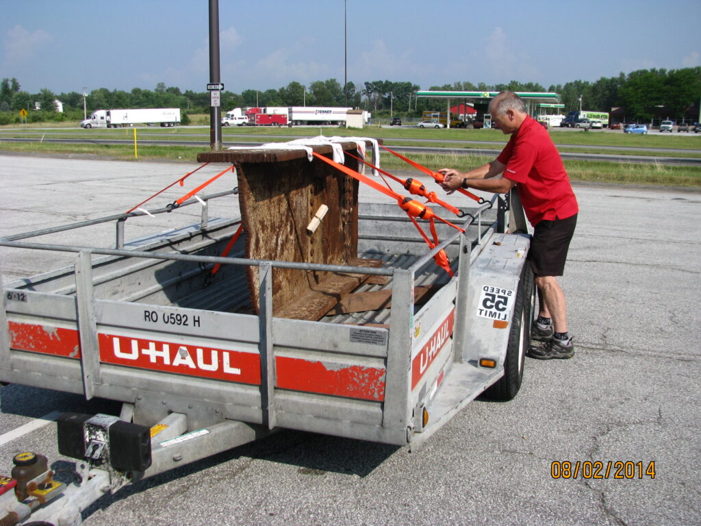 Jerry Gosa securing the steel beam from the North Tower of the World Trade Center onto a U-Haul trailer.