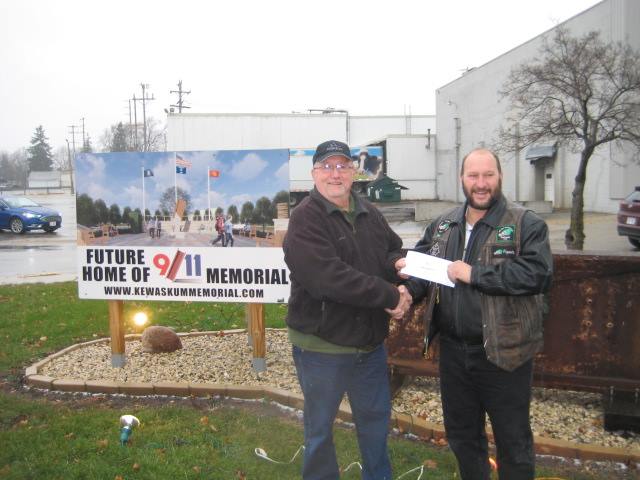 Tom Fabitz receiving a donation for the Wisconsin 9/11 Memorial from the Ozaukee County Guzzlers Motor Cycle Club.