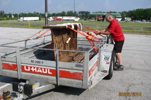 Beam secured in trailer