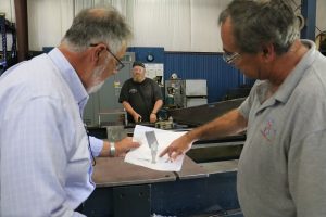 Men holding the beam support design